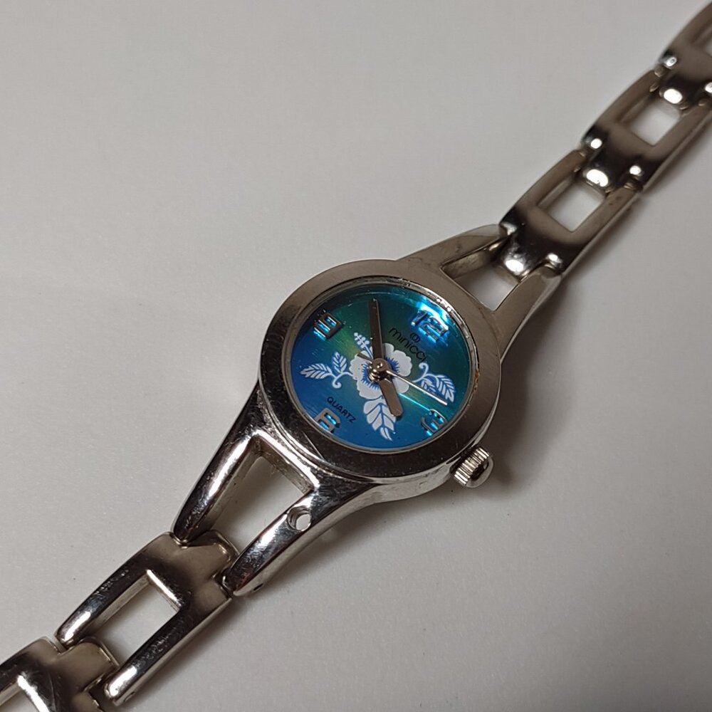7 Inch Silver Tone Minicci Flower Watch With Blue And Green Dial
